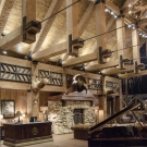 Main Lobby - Large lobby truss system comprised of varying sizes of hand hewed railroad timbers, the largest 24" in width.