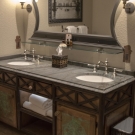 Typical room - Bathroom. Custom vanity with La Lune detailing, copper door panels and natural edge solid counter top.