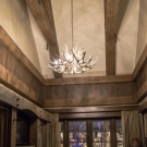 Governor's Suite. One of two rooms on either side of the Governor's Suite. Ceiling trusses, feature wall entertainment center, wainscot, and chair rail.