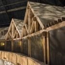 Inner Atrium - Third floor hotel balconies. Hand hewed railroad timbers utilized in trusses, wall decor and support systems.