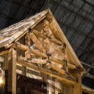 Inner Atrium -Looking up at the front of the Governor's Suite truss and balcony. Hand hewed railroad timbers utilized in trusses, wall decor and support systems.