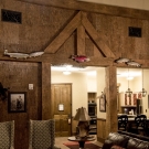 Governor's Suite. Hand hewed trusses, stained and finished bark wall paneling, custom fireplace mantel.