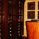 Hostess desk and wine rack at the entrance to Bogart's restaurant and bar