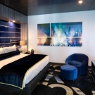 Guest room, bedroom paneling and graphic wall art.