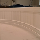 Curved partition wall separating choir area