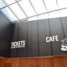 Wall panels above reception and Cafe area.